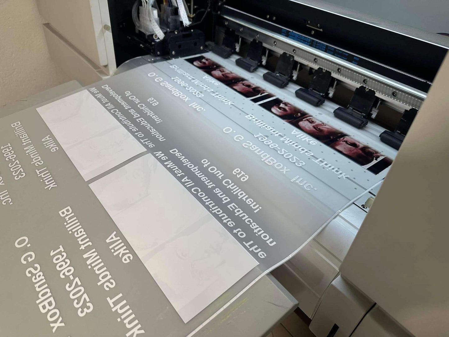 DTF gang sheet printing process on a printer, showcasing vibrant designs and efficient layout.